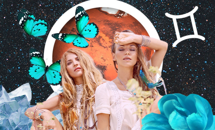 Two women stand against a dark, starry sky surrounded by butterflies, representing Gemini.