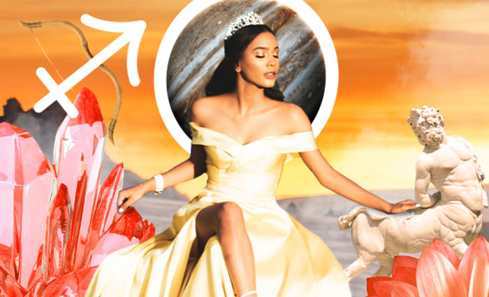 A woman in a gold gown and crown poses against an orange background.